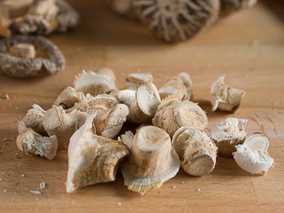 mushroom stalks on chopping board mushroom stalks on chopping board